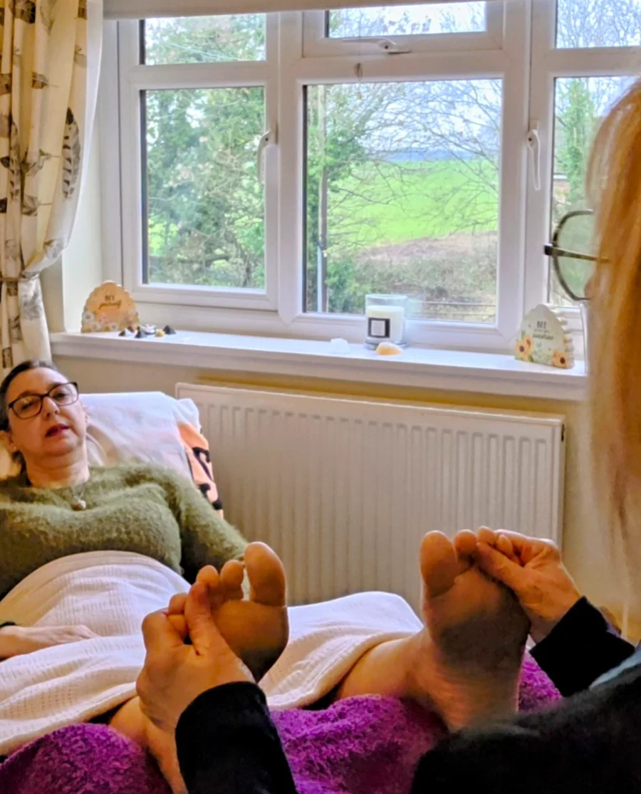 New_Photo_to_replace_white_tower Client relaxing during reflexology treatment in calm setting